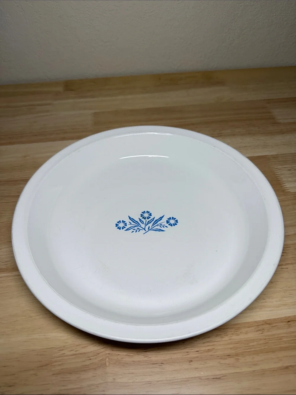 Vintage CorningWare 9-inch pie plate featuring the classic Blue Cornflower.